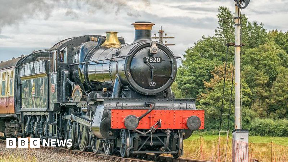 A classic steam locomotive chugging along the countryside.